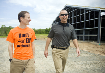 Pastor Bob Kadlecik and Baptist Builders Club Director Michael Nolan tour the construction site.
