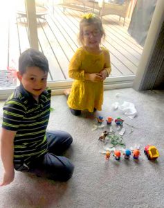 two and three year old with small toys